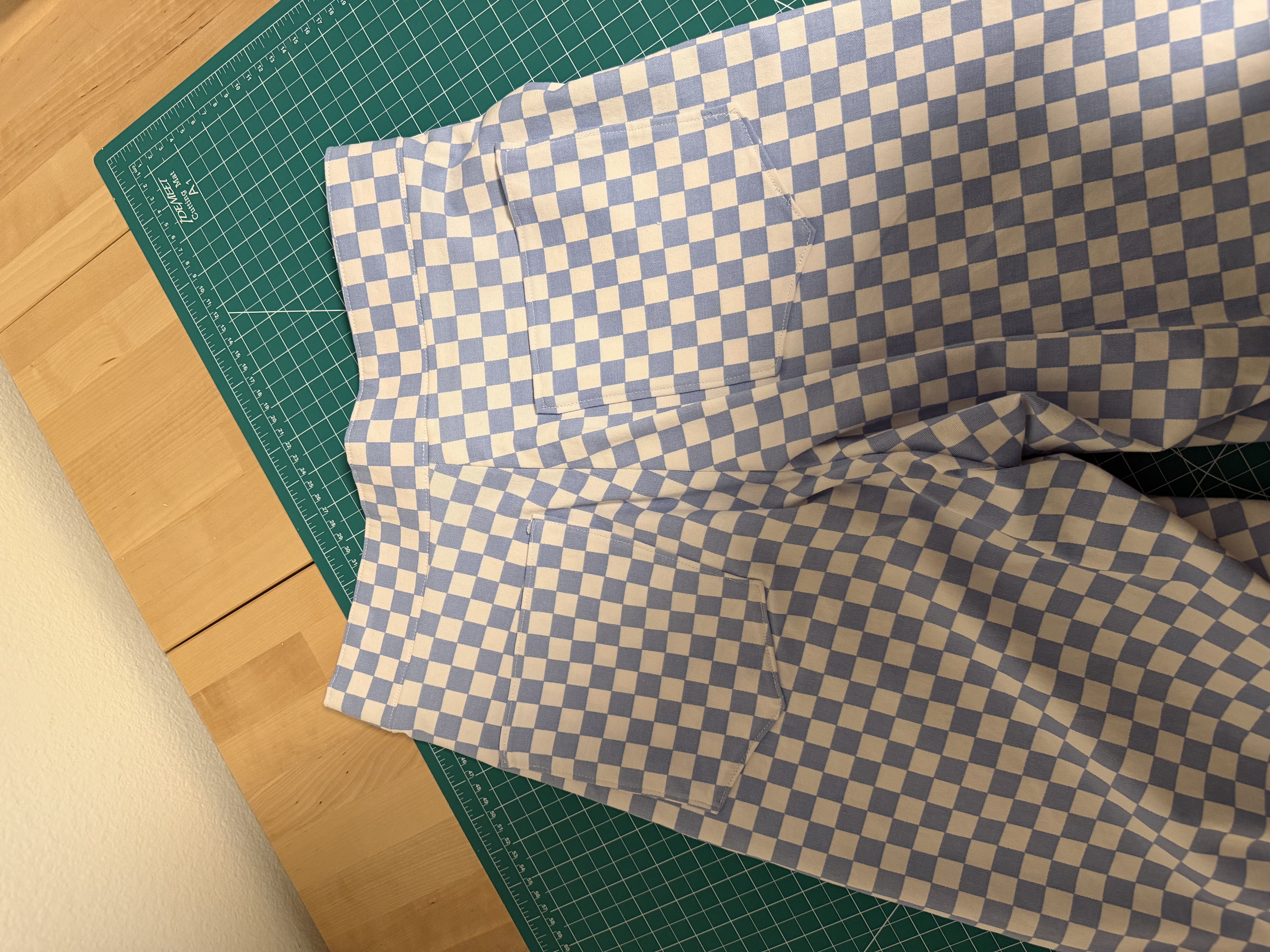 Close up of the two back pockets, checks lined up across both pockets and the center back seam